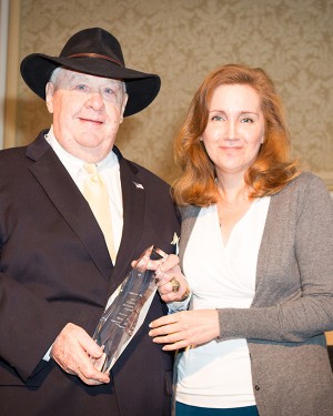 Norm Cates Receiving the Club Industry Lifetime Achievement Award from Pamela Kufahl